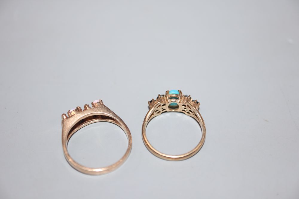 A 9ct gold, turquoise and sapphire cluster ring and a yellow metal and four stone white opal ring, gross 4.9 grams.